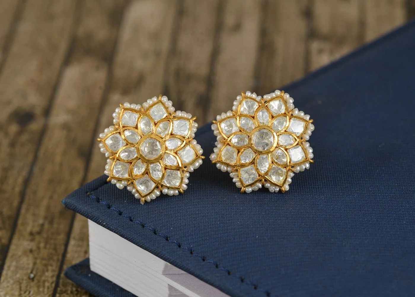 Gold and diamond earrings close up