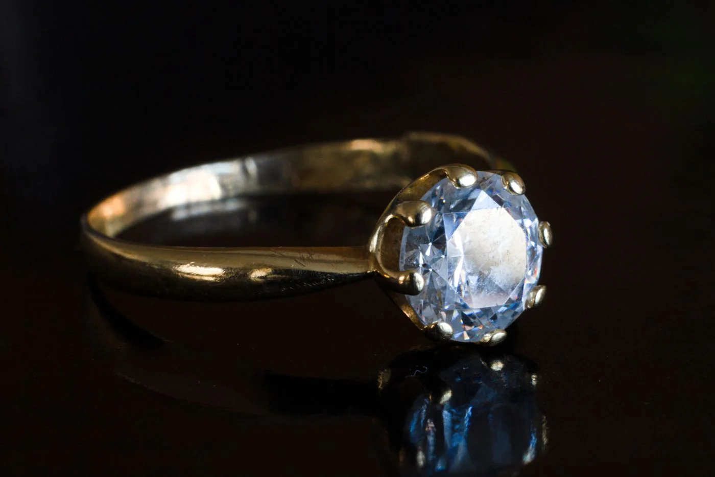 Solitaire diamond ring on black